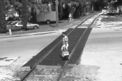 Original image of person walking on train track.